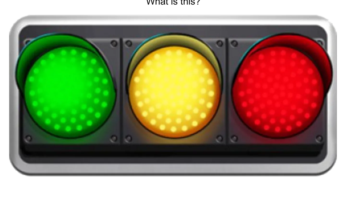 A traffic light with green, yellow and red lights